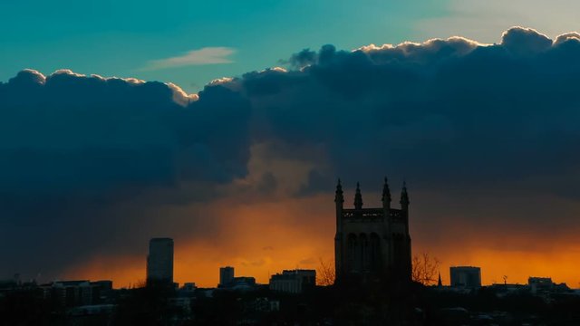 Wide shot of the BT Tower in London, England, UK against a dramatic fiery sky