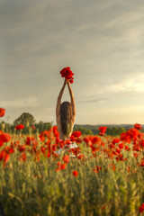 a girl on a poppy field
