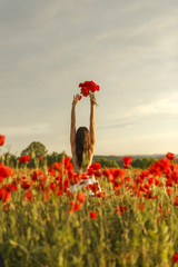a girl on a poppy field