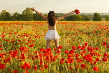a girl on a poppy field