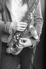 saxophone in girlish hands