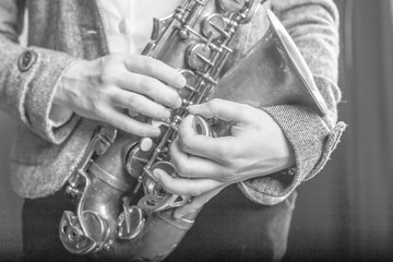 saxophone in girlish hands