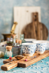 Dry medicinal herbs in bowls.