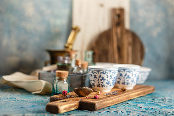 Dry medicinal herbs in bowls.
