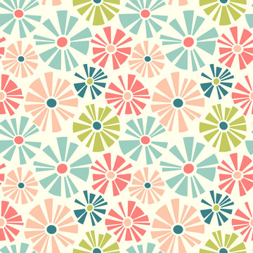 Spring theme seamless pattern of cut out style daisies. Cheerful retro design for fabric, wallpaper, backgrounds and decor.