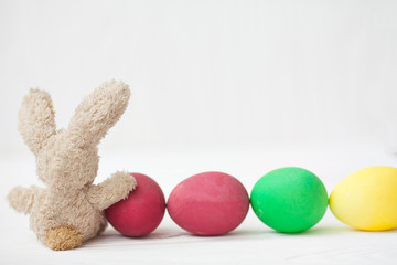Easter eggs and cute bunny. Festive decoration. Happy Easter.