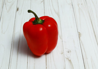 Large red bell peppers on a white Board
