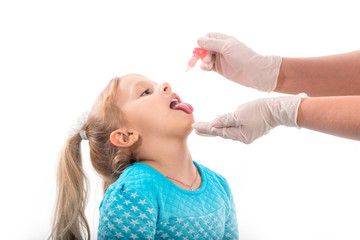 little girl on reception at the doctor receives the polio vaccine, a child being treated for influenza, the child takes the medicine in the hospitalception at the doctor takes antipyretic, anti-flu