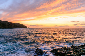 sunset over rocky sea