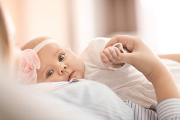 Young mother and her baby at home