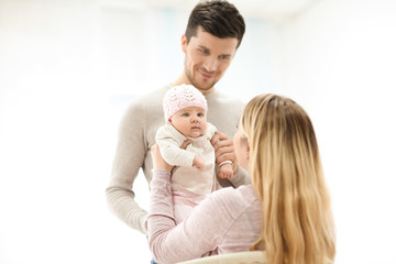 Young parents with baby at home