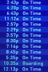 Fototapeta premium Flight departures board at JFK Airport in New York, NY