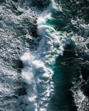 Aerial view of sea waves crashing