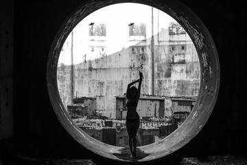 girl in a round window