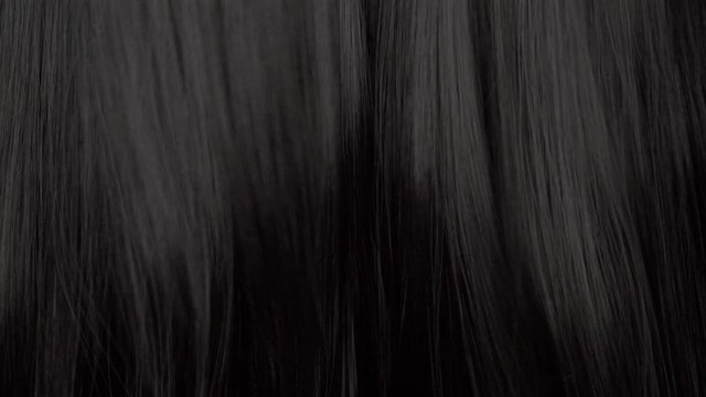 Hair texture background, no person. Black shiny hair moving slowy