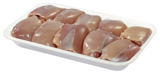 raw chicken meat in plastic tray isolated on white background
