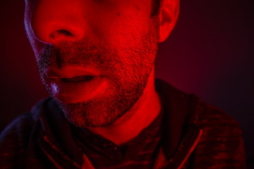 Close up on man open mouth with serious facial expression