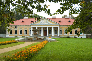 Fototapeta na wymiar Manor in classical style on cloudy day