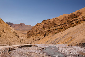 Scenic  canyon landscape with curly road along the river on himalaya highlands. Region Ladakh. India. State Jammu and Kashmir.