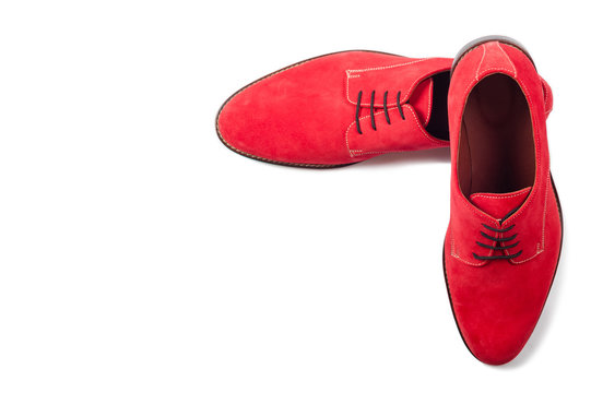 Red men suede shoes isolated on white background top view