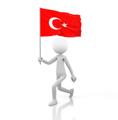 Small Person Walking with Turkey Flag in a Hand