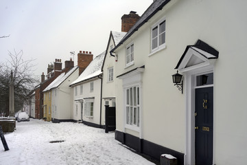 Snowy winter street scene at Odiham in Hampshire, UK