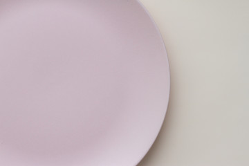 Empty ceramic plate pattern design on light background.