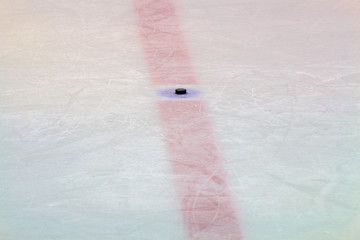 Hockey puck on ice stadium 