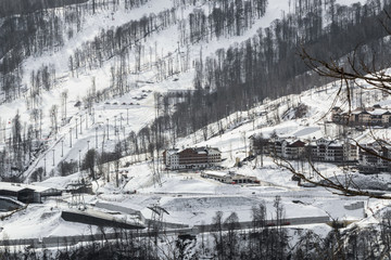 ski resort on the mountainside of a house on the snowy mountains