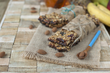 useful breakfast of muesli and dried fruits. Wooden background. A delicious morning. Place for text. Healthy food. Vegetarian. copy space