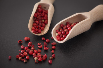Brazilian pepper on the dark stone table