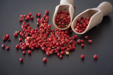 Brazilian pepper on the dark stone table