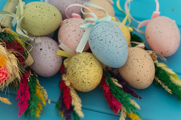 Naklejka na ściany i meble Traditional Easter eggs and decoration on wooden blue background.