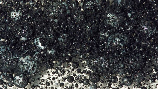 Top view Bright Collors Bubbles Slow Motion Oil Ink is fantastic structure of colorful chaotic motion bubbles stock video is a beautiful, unique, organic.