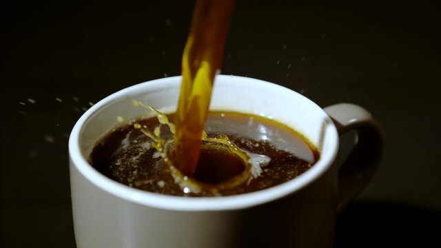 Pouring coffee into cup, Ultra Slow Motion
