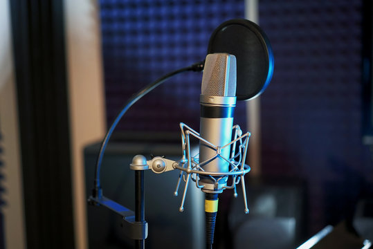 Professional microphone in the recording studio. Musical Concept. Microphone on stage.