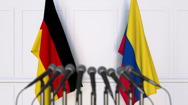 Flags of Germany and Colombia at international meeting or negotiations press conference