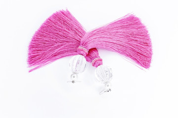 Pink handmade earrings on a white background.