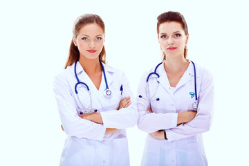 Fototapeta premium Two young woman doctor , standing in hospital. Two young woman doctor.