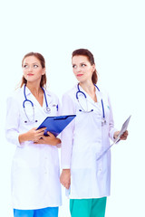 Fototapeta premium Two woman nurse watching X Ray image, standing in hospital. X Ray . Two woman doctor
