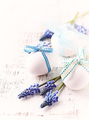 Easter Decoration. White Eggs with Blue Ribbons