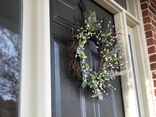 Spring Wreath on Front Door of House
