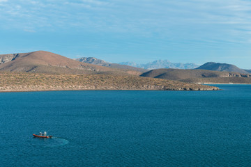Boats against hills