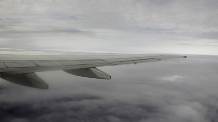 A plane flying in the clouds 