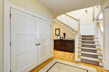 Lakefront home foyer with staircase