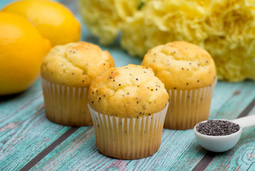 Lemon Poppyseed Muffins on a Blue Wooden Table