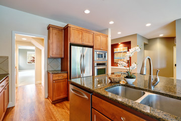 Bright Inviting kitchen features granite counters.