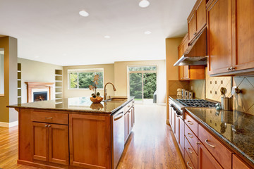 Bright Inviting kitchen features granite counters.