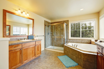 Gorgeous spa like bathroom with two vanity cabinets.