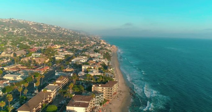 DANA POINT, California. Doheny State Beach. A sunny day beach scene with people engaged in beach activities. Surfers. Aeria 4K